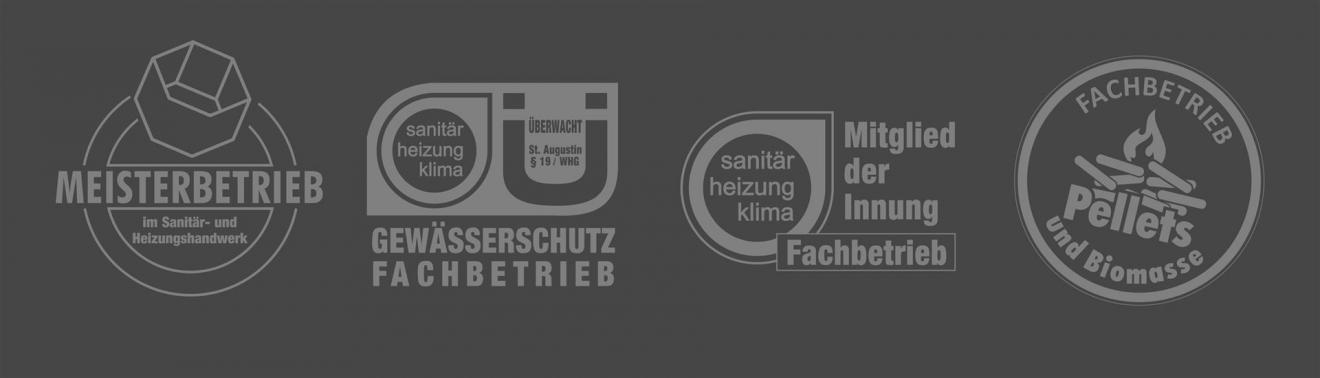 Zu sehen sind Logos: Meisterbetrieb, Gewässerschutzfachbetrieb, Mitglied der Innung, Pellet Fachbetrieb